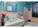 Bright bathroom features a sink vanity, with a tub and shower in the background at 2844 Whispering Hills Dr, Chamblee, GA 30341