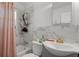Well-lit bathroom featuring tile walls, an updated sink and vanity, and a shower with curtain at 2844 Whispering Hills Dr, Chamblee, GA 30341