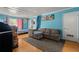 Bedroom featuring hardwood floors, natural light, and a pet cage at 2844 Whispering Hills Dr, Chamblee, GA 30341