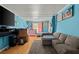 Comfortable bedroom with hardwood floors, large windows, and a cozy couch at 2844 Whispering Hills Dr, Chamblee, GA 30341