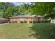 Charming one-story brick home featuring a well-manicured lawn and traditional design at 2844 Whispering Hills Dr, Chamblee, GA 30341