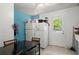 Cozy eat-in kitchen featuring tiled floor, a white refrigerator, and a view of the outdoors at 2844 Whispering Hills Dr, Chamblee, GA 30341