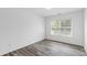 Bedroom with a window offering ample natural light and neutral-toned walls at 3291 Pepperpike Ct, Loganville, GA 30052