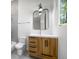 This bathroom features a modern vanity, an updated mirror, and beautiful natural light at 4785 Longchamps Dr, Sandy Springs, GA 30319