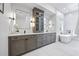 Luxurious bathroom with double vanity, soaking tub, and elegant fixtures at 4785 Longchamps Dr, Sandy Springs, GA 30319