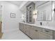 Stylish bathroom featuring a double vanity, with cabinetry and large mirrors at 4785 Longchamps Dr, Sandy Springs, GA 30319