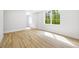 Bright bedroom with hardwood floors, natural light, and neutral walls, creating a serene space at 4785 Longchamps Dr, Sandy Springs, GA 30319