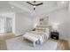 Bright bedroom featuring a tray ceiling, ceiling fan, and neutral colors at 4785 Longchamps Dr, Sandy Springs, GA 30319