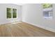 Bright bedroom with hardwood floors and abundant natural light from two windows at 4785 Longchamps Dr, Sandy Springs, GA 30319