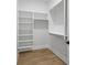 Large walk-in closet with custom shelves and racks, offering great storage solutions at 4785 Longchamps Dr, Sandy Springs, GA 30319