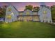 Beautiful two-story home showcasing modern design, large windows and a well-kept lawn at 4785 Longchamps Dr, Sandy Springs, GA 30319