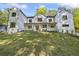 Stunning two-story modern farmhouse exterior with white siding, black trim, and inviting front porch at 4785 Longchamps Dr, Sandy Springs, GA 30319