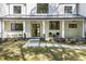 Inviting front porch with black framed windows, brick facade, and stepping stone walkway at 4785 Longchamps Dr, Sandy Springs, GA 30319