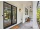 Inviting front porch with painted brick, tiled floors, and stylish lighting fixtures at 4785 Longchamps Dr, Sandy Springs, GA 30319