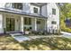 Inviting front porch with black framed windows, brick facade, and stepping stone walkway at 4785 Longchamps Dr, Sandy Springs, GA 30319