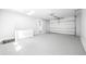 Spacious garage featuring epoxy floors and an automatic door, providing secure parking and storage at 4785 Longchamps Dr, Sandy Springs, GA 30319