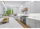 Bright kitchen featuring white cabinetry, stainless steel appliances, and a large center island at 4785 Longchamps Dr, Sandy Springs, GA 30319