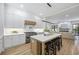Bright, modern kitchen features a large center island with seating and stainless steel appliances at 4785 Longchamps Dr, Sandy Springs, GA 30319