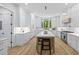 Bright kitchen with white cabinets, stainless steel appliances, and a large center island at 4785 Longchamps Dr, Sandy Springs, GA 30319