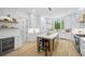 Bright kitchen featuring white cabinetry, stainless steel appliances, and a center island at 4785 Longchamps Dr, Sandy Springs, GA 30319