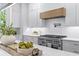 Bright kitchen showcasing white cabinetry, stainless steel range, quartz countertops, and modern hardware at 4785 Longchamps Dr, Sandy Springs, GA 30319