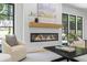 Living room featuring modern fireplace, comfortable seating, and plenty of natural light at 4785 Longchamps Dr, Sandy Springs, GA 30319
