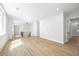 Bright living room features wood floors, white walls, and light-filled windows at 4785 Longchamps Dr, Sandy Springs, GA 30319