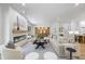 Spacious living room featuring modern fireplace, dining area, and an open-concept layout at 4785 Longchamps Dr, Sandy Springs, GA 30319