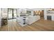 Open-concept living room boasting a fireplace, modern lighting, and access to the backyard at 4785 Longchamps Dr, Sandy Springs, GA 30319