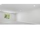 Spacious living room with recessed lighting and natural light and light carpet at 4785 Longchamps Dr, Sandy Springs, GA 30319