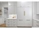 Bright pantry features white cabinets and gold hardware, offering ample storage space at 4785 Longchamps Dr, Sandy Springs, GA 30319
