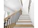Elegant staircase featuring hardwood treads and black railings, adding a touch of sophistication at 4785 Longchamps Dr, Sandy Springs, GA 30319