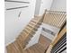 Modern staircase with wood steps and black metal railings at 4785 Longchamps Dr, Sandy Springs, GA 30319