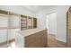 Bright walk-in closet with custom organizers and center island at 4785 Longchamps Dr, Sandy Springs, GA 30319