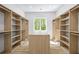 Spacious walk-in closet with custom shelving and center island at 4785 Longchamps Dr, Sandy Springs, GA 30319
