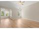 Spacious bedroom with vaulted ceilings, ceiling fan, hardwood floors, and lots of natural light at 4912 Waters Edge Trl, Roswell, GA 30075