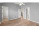 Light-filled bedroom with hardwood floors and an en suite bath at 4912 Waters Edge Trl, Roswell, GA 30075