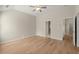 Bedroom with hardwood floors, fan, and vaulted ceilings leading to other rooms at 4912 Waters Edge Trl, Roswell, GA 30075