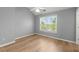 Light-filled bedroom with hardwood floors and a ceiling fan at 4912 Waters Edge Trl, Roswell, GA 30075