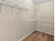 Walk-in closet with vinyl floors and metal shelving at 4912 Waters Edge Trl, Roswell, GA 30075
