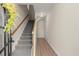 Inviting entryway with wood-look floors, a stairway to the upper level, and neutral paint at 4912 Waters Edge Trl, Roswell, GA 30075