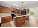 Modern kitchen with a functional island, stainless steel appliances and ample storage with a view to the living room at 4912 Waters Edge Trl, Roswell, GA 30075