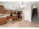 Spacious open kitchen featuring wood cabinets, stainless steel appliances, and a breakfast bar at 4912 Waters Edge Trl, Roswell, GA 30075