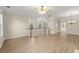 Spacious living area with wood floors, ample natural light, and a ceiling fan at 4912 Waters Edge Trl, Roswell, GA 30075
