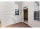 Enclosed patio with wood-slat floor, painted-wood siding, and white-trimmed windows and door at 4912 Waters Edge Trl, Roswell, GA 30075