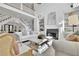 Bright living room with a large fireplace, hardwood flooring, and modern decor at 690 Ebenezer Rd, Milton, GA 30075