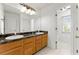 Bright bathroom featuring a double sink with a dark countertop and white cabinets at 1170 Moseley Rd, Stockbridge, GA 30281
