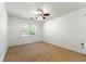 Cozy bedroom featuring neutral carpet and a window providing ample natural light creating a serene retreat at 1170 Moseley Rd, Stockbridge, GA 30281