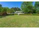 Charming single-story home with a lush front lawn and manicured landscaping creating a welcoming curb appeal at 1170 Moseley Rd, Stockbridge, GA 30281