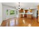 Bright eat-in kitchen featuring a bay window, a center island and wooden cabinetry creating a functional design at 1170 Moseley Rd, Stockbridge, GA 30281